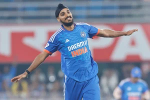 Arshdeep Singh celebrating a wicket during a T20 World Cup match after surpassing Jasprit Bumrah’s wicket tally for India.