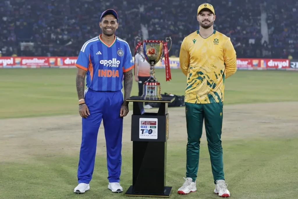 Indian and South African cricket players during a T20 World Cup match with a packed stadium crowd.